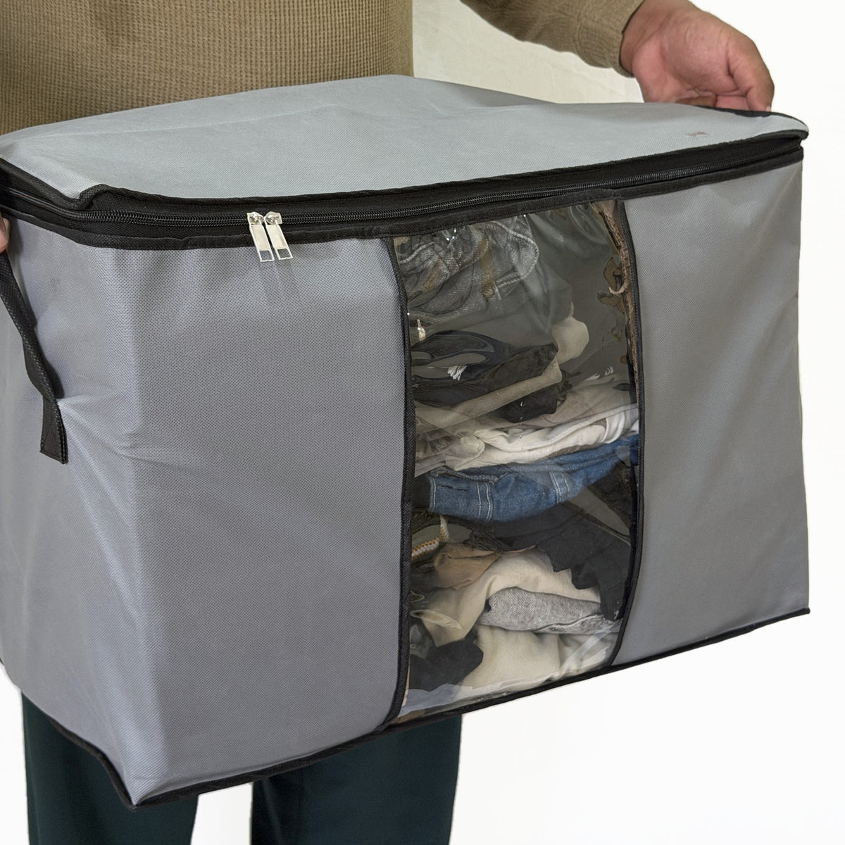 Bag held in two hands, to show its size